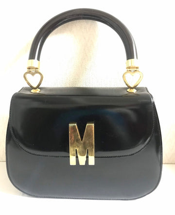 MOSCHINO Vintage black patent enamel Kelly style handbag with M logo and heart motifs