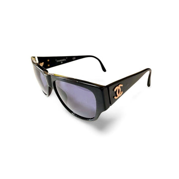 CHANEL Vintage black frame sunglasses with golden CC motifs at sides