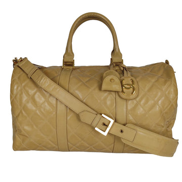 CHANEL Chanel Chanel quilted travel bag in beige patent leather
