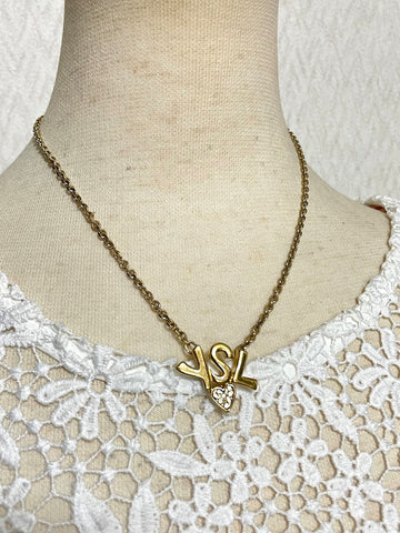 YVES SAINT LAURENT Vintage golden YSL logo and heart crystal necklace