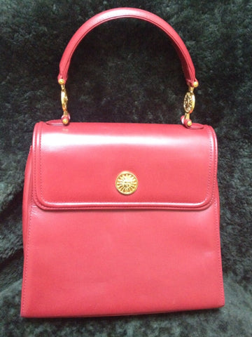GIANNI VERSACE Vintage apricot red leather Kelly style bag with Medallion Sunburst charms