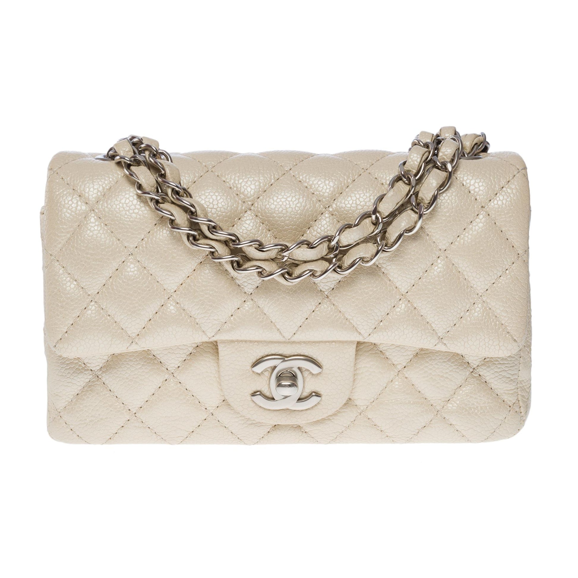 CHANEL Splendid Timeless Mini Flap bag in off white pearl quilted leat