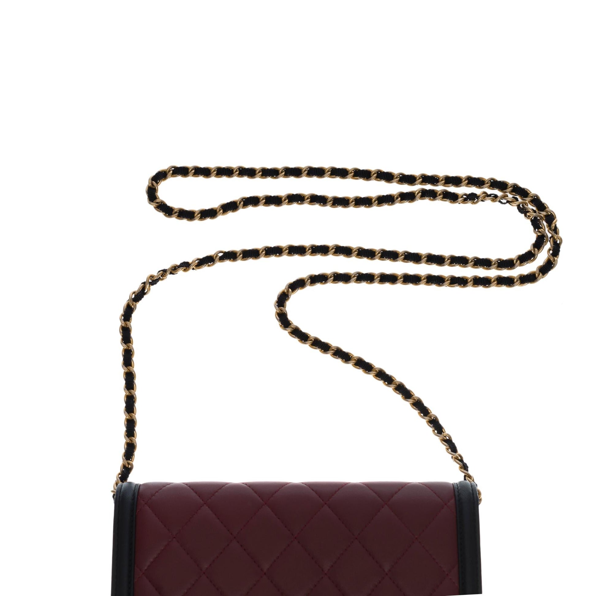CHANEL Wallet on Chain shoulder bag in burgundy/black quilted leather