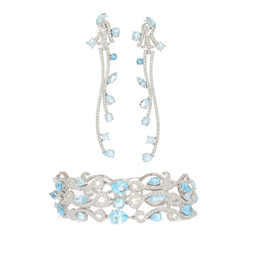 Earrings and bracelet parure in 750 white gold paved set brilliant-cut diamonds as well as topazes of various sizes