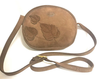Vintage Longchamp brown suede leather oval round shape shoulder bag with leaf applique motifs. Rare and unique bag back in the old era.