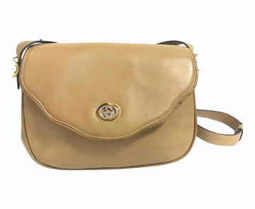 GUCCI Vintage nude brown leather shoulder bag with golden and silver tone GG logo motif and wavy design flap