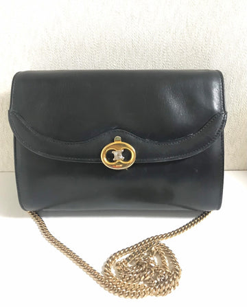 CELINE Vintage genuine black leather shoulder bag with gold and silver tone triomphe logo motif at front