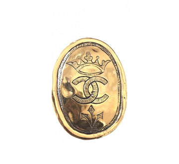 CHANEL Vintage gold tone large brooch in oval coin shape with CC logo and crown embossed motif