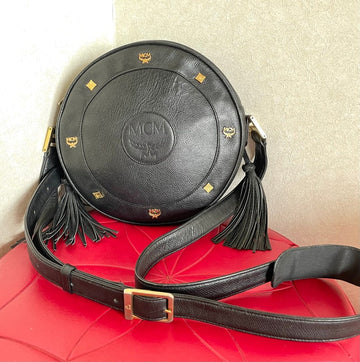 MCM Vintage black suzy wong, grained leather round shoulder bag with golden logo studs and fringes