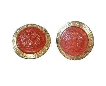 GIANNI VERSACE Vintage orange candy earrings with gold tone frames and Medusa face