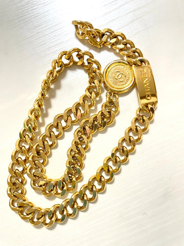 CHANEL Vintage golden thick chain belt with a CC charm and logo plate