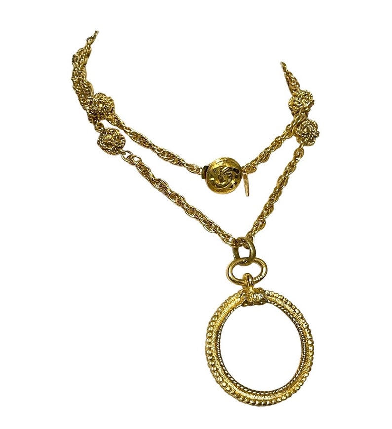 CHANEL Vintage golden chain necklace with loupe glass pendant top and