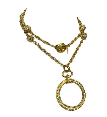 CHANEL Vintage golden chain necklace with loupe glass pendant top and ball charms