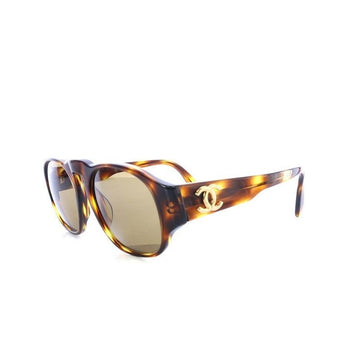 CHANEL Vintage brown oval frame sunglasses with golden CC motifs at sides