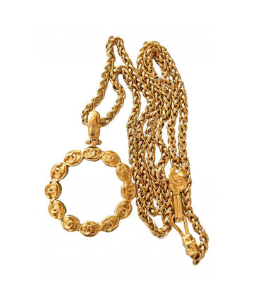 CHANEL Vintage long chain necklace with round glass loupe pendant top and CC motifs