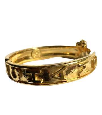 CHANEL Vintage golden bangle with logo marks and chain stopper