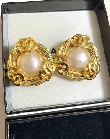 CHANEL Vintage large golden round earrings with faux pearl and CC motifs