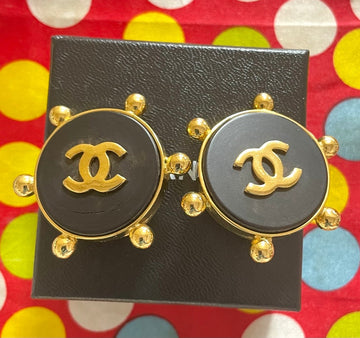 CHANEL Vintage large round earrings with black and golden CC mark