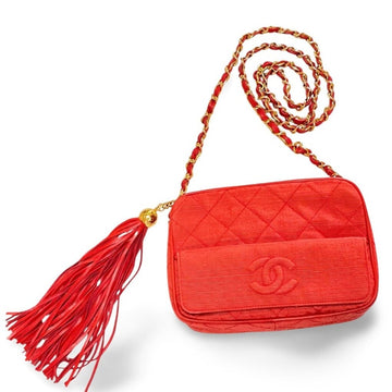 CHANEL Vintage red woven canvas camera bag style shoulder bag with a tassel and CC mark