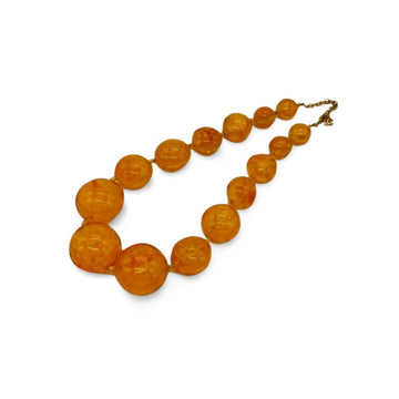 CHANEL Vintage orange resin beaded charm necklace with cc mark and camellia motifs
