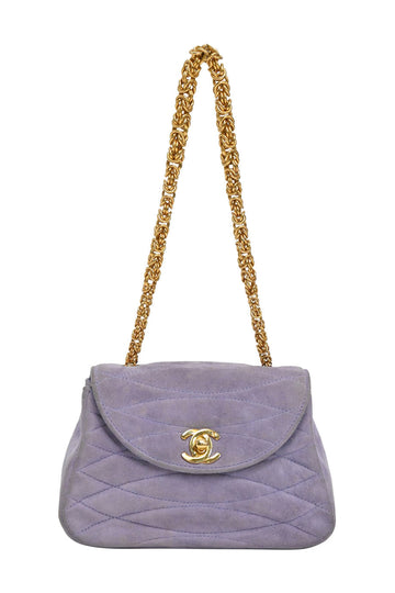 CHANEL Lilac quilted suede half moon chain flap bag with 24-karat yellow gold plated hardware
