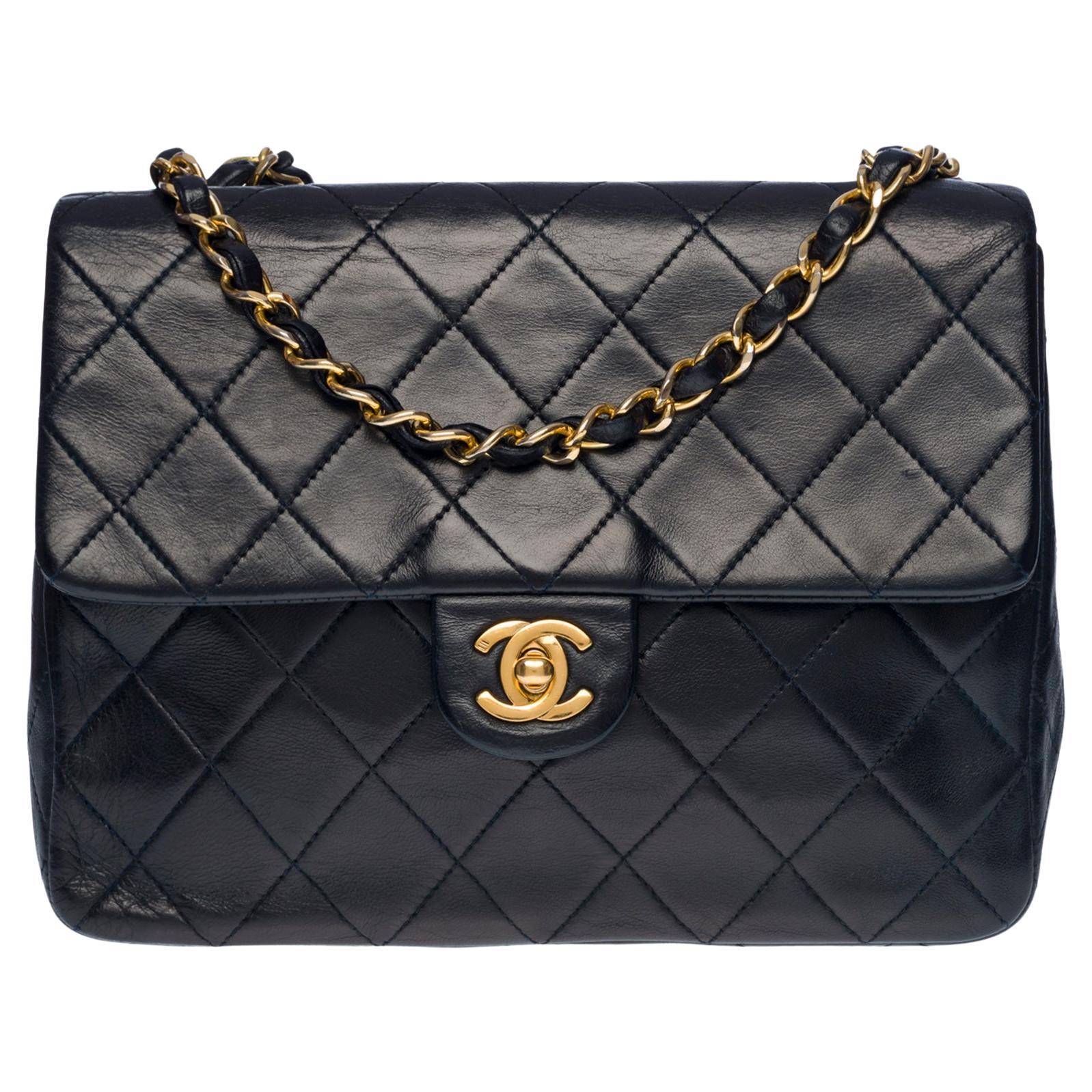 CHANEL Mini Timeless flap shoulder bag in navy blue quilted lambskin