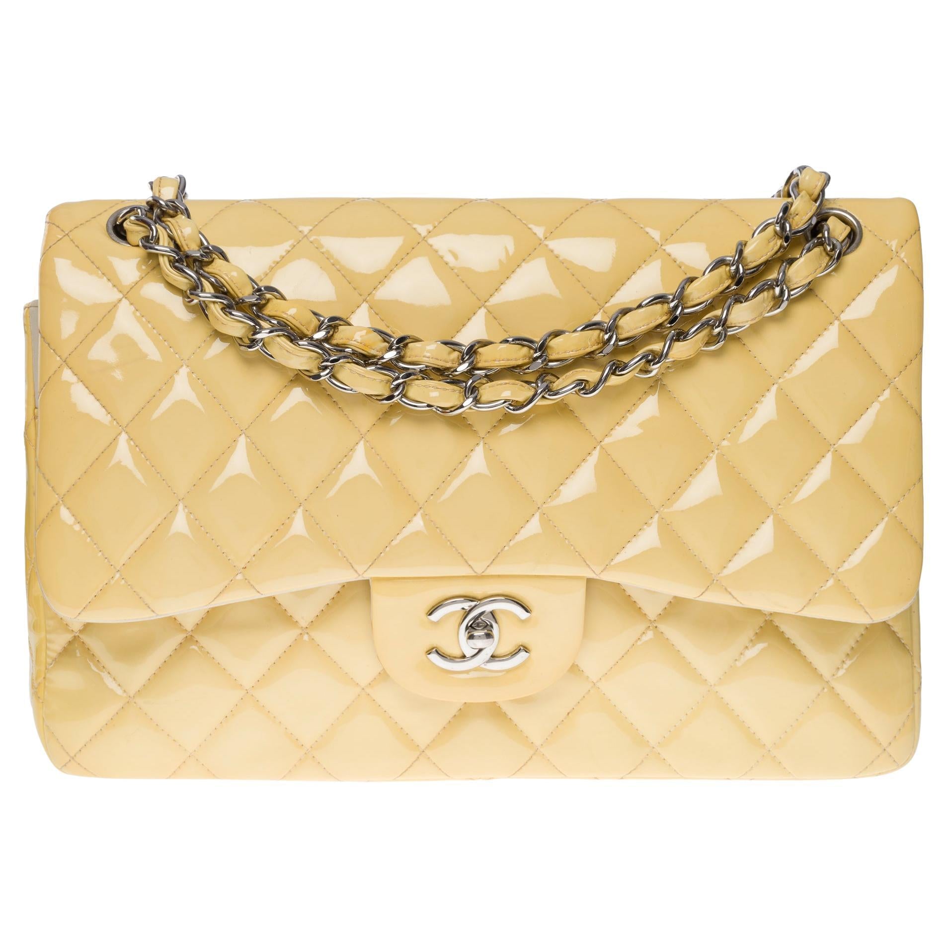 CHANEL Timeless Jumbo double flap shoulder bag in yellow patent leathe